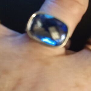 Women's silver ring with rectangle blue topaz stone marked with TC inside ring